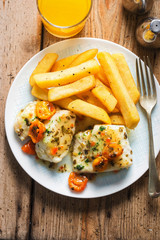 Cod fillets with cherry tomato, white wine & basil dressing served with chips