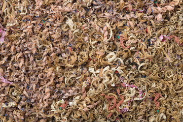 Wooden shavings from colored pencils background