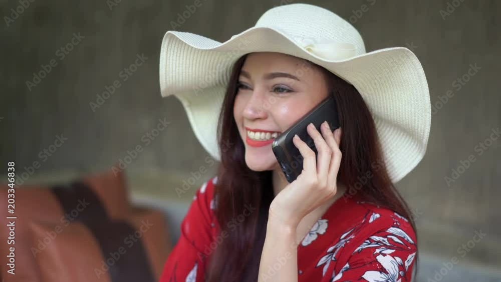 Wall mural beautiful woman talking on mobile phone 