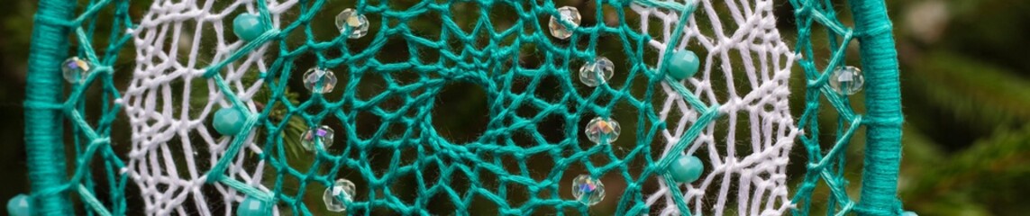 Banner of Handmade dream catcher with feathers threads and beads rope hanging
