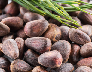 Obraz na płótnie Canvas Unshelled pine nuts. Macro. Food background.