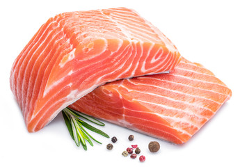 Fresh raw salmon fillets on white background.