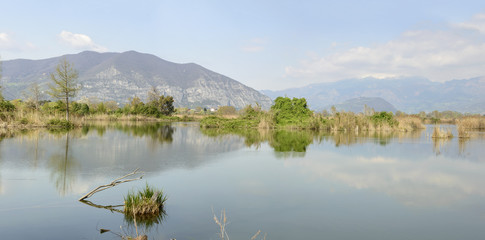 panoramic landscape at nature oasis lagoon, Iseo, Italy