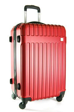 Red color travel suitcase isolated on white background.
