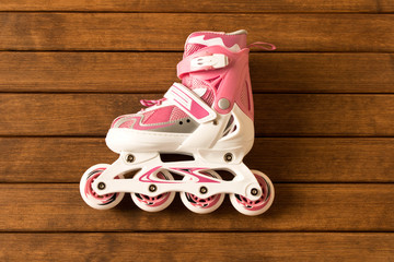 Roller skates on wooden background . Sport.  Healthy lifestyle