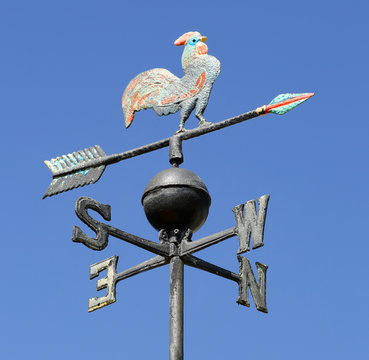vintage weathercock and sky on background