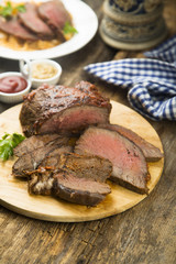 Homemade roastbeef on wooden board