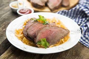 Beef fillet serves with sauerkraut