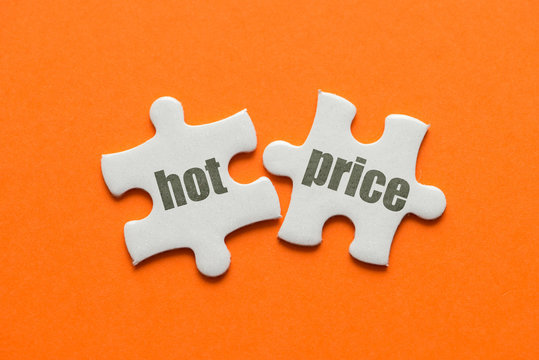 The Word HOT PRICE On Two Matching Puzzle On Orange Background