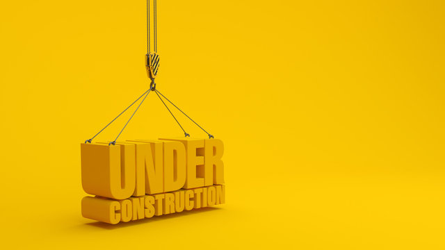 Under construction sign and crane hook  on yellow background