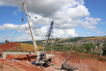 Crane lifting a bridge beam