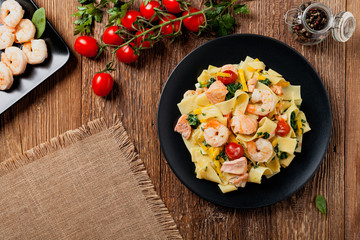 Traditional Italian fettuccini with salmon, shrimp and spinach.