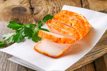Pork lard with greens on a wooden table.