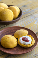 Pumpkin scones with cream and fruit jam