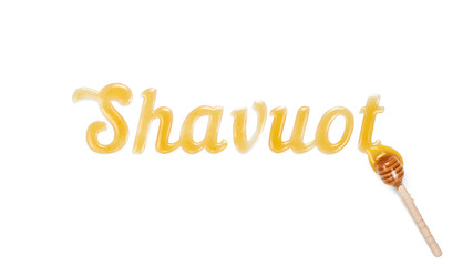 Food typography phrase Shavuot spelling with honey. Lettering on white background