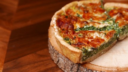 Quiche a savoury open tart or flan consisting of pastry crust with spinach mushrooms cheese. - Powered by Adobe