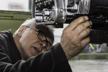 Aircraft mechanic while working. 