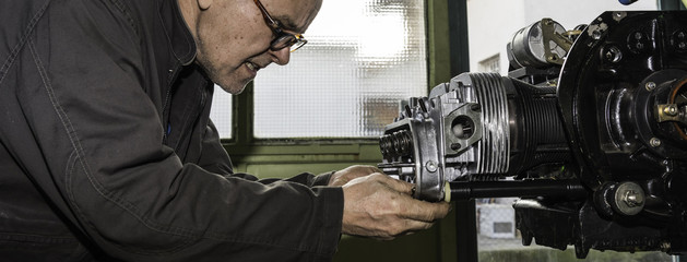 Aircraft mechanic while working. 
