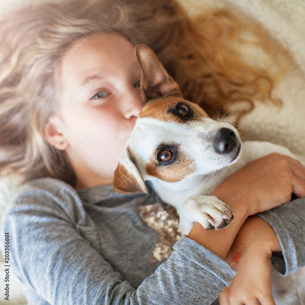 Wall mural happy child with dog