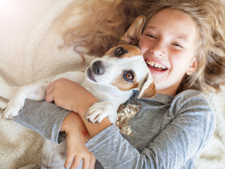Fototapety  Happy child with dog