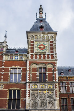 Architectural fragments of Historic building of Amsterdam central railway station (Amsterdam Centraal), Netherlands. Amsterdam Centraal's building first opened in 1889.