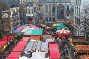 Fototapeta na wymiar Cityscape - view of the Christmas Market on background the Aachen Cathedral, North Rhine-Westphalia, Germany