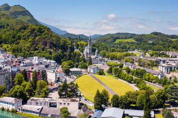 View of the city Lourdes - the Sanctuary of Our Lady of Lourdes, the Hautes-Pyrenees department in...