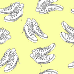 Hand drawn pairs of classic vintage hipster sneakers seamless pattern on yellow background. Vector illustration,  fashion design shoes icon. Sketch style outlines. For wrapping paper, fabric textile.