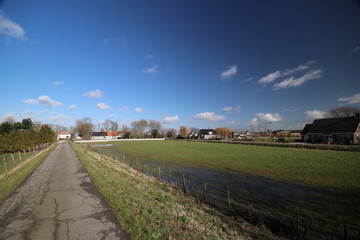 Fototapeta premium Wide angle view of polder Wilde Veenen at Donderdam between the villages of Moerkapelle and Waddinxveen in the Netherlands