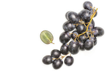 Black grape cluster (autumn royal variety) with one halved berry top view isolated on white background.