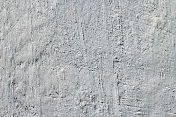 Grungy white concrete wall background. Wall with painted stucco