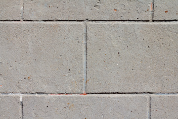 Grungy grey concrete brick wall background. Wall with bricks