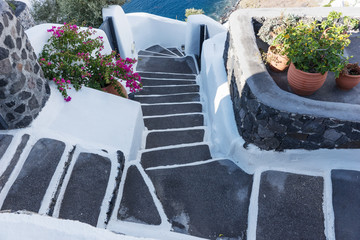 Stairs to the aegean sea in Santorini village of Oia, Greece