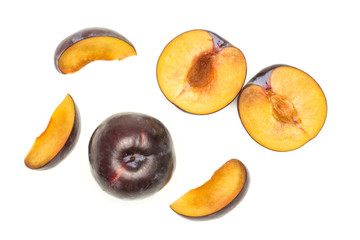 Red blue plums set top view isolated on white background one whole two section halves three slices.