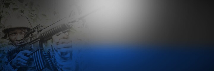 Low angle view of military soldier aiming with rifle amidst