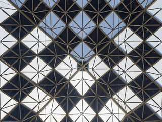 Shopping Center ceiling of glass and metal with a repeating symmetrical patterns