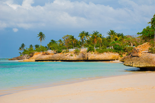 Holguin, Guardalavaca Beach, Cuba: Caribbean sea with beautiful blue-turquoise water and gentle sand and palm trees. Paradise landscape.