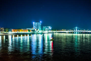 Fototapeta na wymiar Cologne along river Rhine, Germany. Night view. Travel photo for postcards.