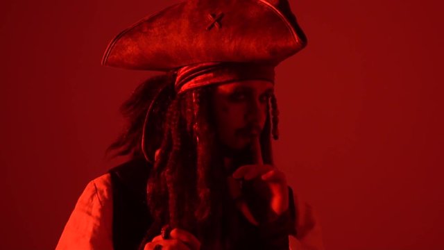 Pirate with dreadlocks in red light