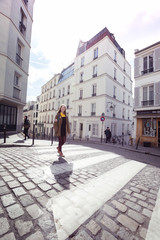 girl is walks around Montmartre