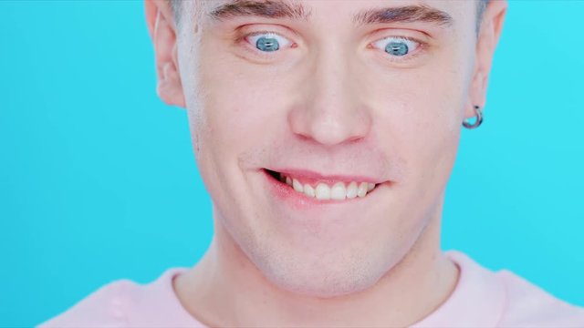 Close-up face of a boy with blue eyes.
