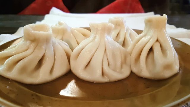 Five hot tasty aroma khinkali in the plate 