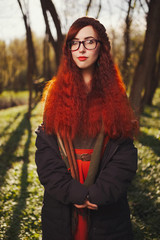 red haired girl in the forest