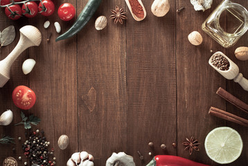 herbs and spices on wood background