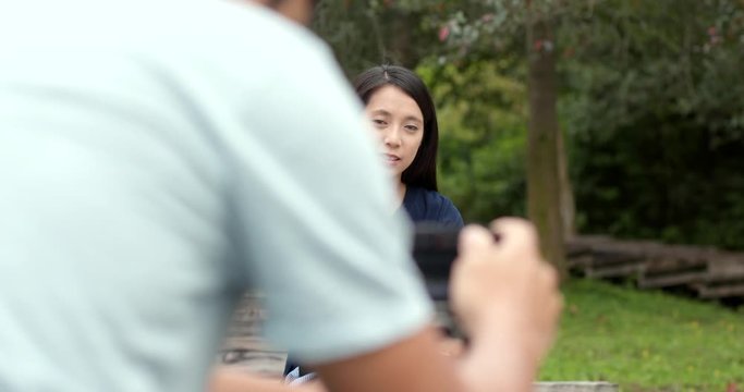 Couple setting camera for taking photo together at outdoor