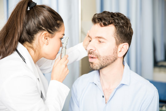 Patient's eyes being examined by doctor