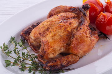  Fried chicken with a thyme, is served with stewed tomatoes