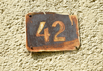 House number 42 on the wall of a building
