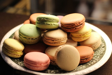 many colorful makroon on a plate
