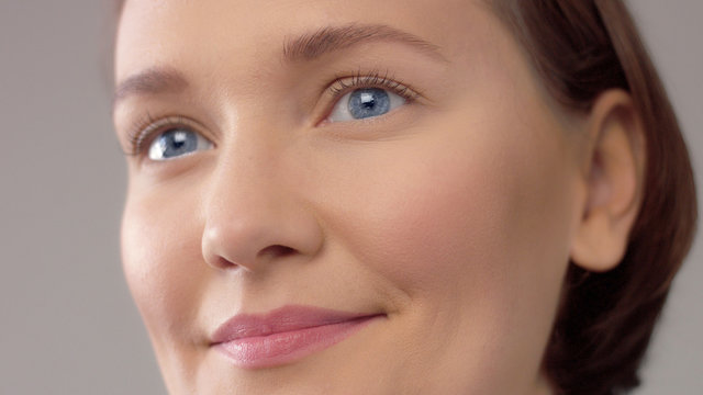 closeup portrait of middle age woman showing her skin closeup with ideal skin smiling